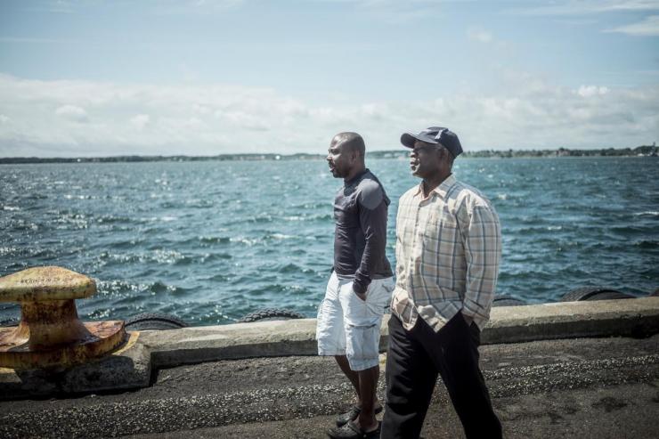 De ghaneserne arbejdere Reuben Kotei og Justice Numo tjente mindre end 9.000 kroner om måneden i løn i flere år hos en dansk skibsreder, men rederen blev frifundet for menneskehandel til tvangsarbejde.